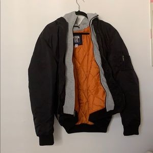 black puffer jacket with a grey hoodie